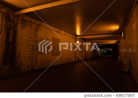 Under a dark guard illuminated by a sodium lamp Under a dark guard illuminated by a sodium lamp 69657005