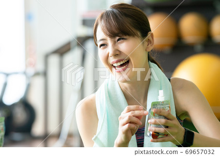 Women feeding at a sports gym Women feeding at a sports gym 69657032