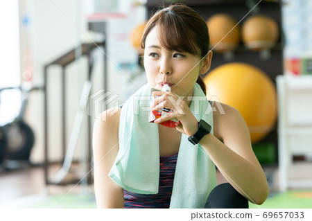 Women feeding at a sports gym 69657033