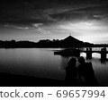 A love couple enjoying sunset at Peirce Reservoir Singapore. 69657994