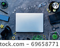 Workplace with gadgets, coffee cup and glasses 69658771