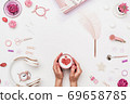 Workspace with coffee cup in hand on copy space 69658785