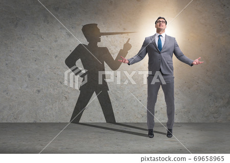 Concept of businessman liar with his shadow 69658965
