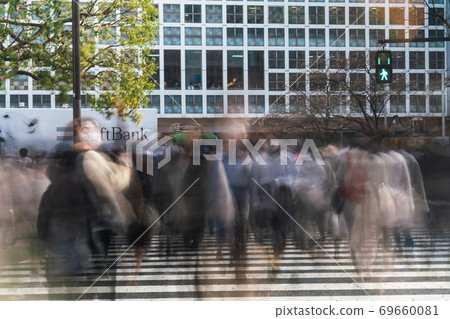 People crossing a scrambled intersection in Shibuya People crossing a scrambled intersection in Shibuya 69660081