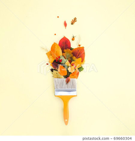 Brush paint with colorful autumn leaves, creative concept of autumn, leaf fall 69660304
