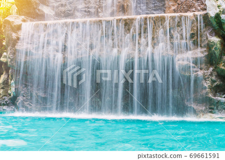landscape of beautiful Artificial waterfall in garden at the public park 69661591