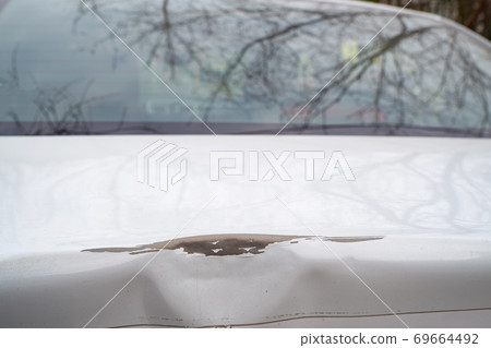 car body after impact. a road traffic accident. 69664492
