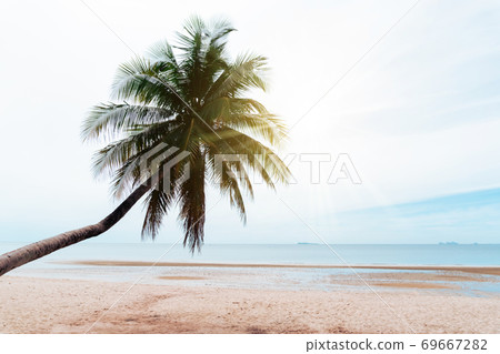 Tropical nature clean beach and white sand in summer with sun light blue sky and bokeh background. 69667282