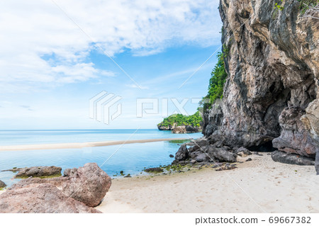 Tropical nature clean beach and white sand in summer with rock mountain blue sky. 69667382