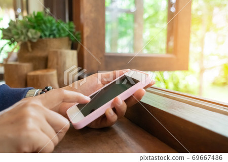 Woman hand using smartphone to do work business, social network, communication. Woman hand using smartphone to do work business, social network, communication. 69667486