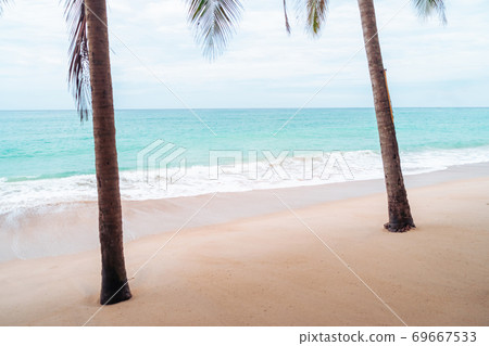 Tropical nature clean beach and white sand in summer with sun light blue sky and bokeh background. Tropical nature clean beach and white sand in summer with sun light blue sky and bokeh background. 69667533