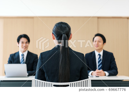 Women interviewed by a company Women interviewed by a company 69667776