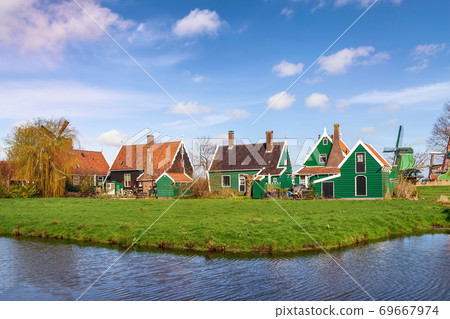 Amsterdam Netherlands, Dutch Windmill and traditional house at Zaanse Schans Village Amsterdam Netherlands, Dutch Windmill and traditional house at Zaanse Schans Village 69667974
