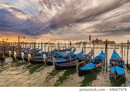 Venice Italy, sunrise city skyline at Grand Canal with Gondola boat Venice Italy, sunrise city skyline at Grand Canal with Gondola boat 69667976