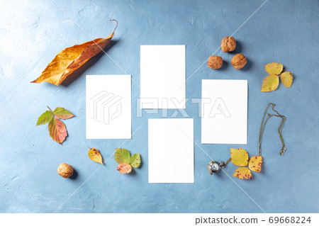 Autumn stationery mockup, flatlay top shot of four vertical A5 cards Autumn stationery mockup, flatlay top shot of four vertical A5 cards 69668224