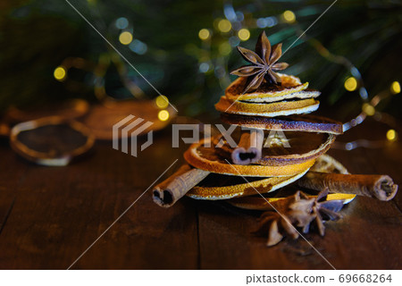 Christmas tree made of dried oranges, cinnamon sticks and anise star seeds 69668264