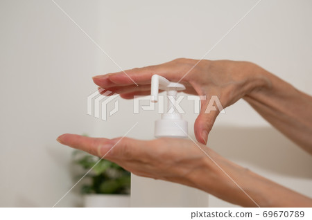 Corona measures Hand disinfection and sterilization at the entrance 69670789