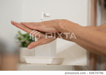 Corona measures Hand disinfection and sterilization at the entrance 69670796