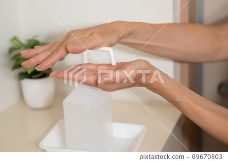 Corona measures Hand disinfection and sterilization at the entrance 69670803