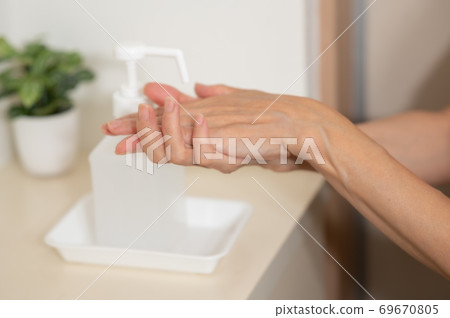 Corona measures Hand disinfection and sterilization at the entrance 69670805