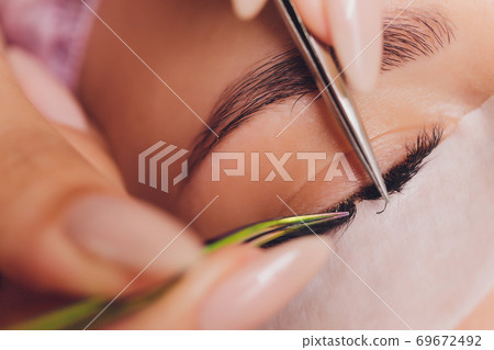 Woman Eye with Long Eyelashes. Eyelash Extension. 69672492