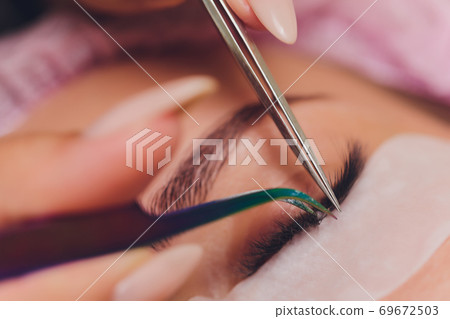 Woman Eye with Long Eyelashes. Eyelash Extension. Woman Eye with Long Eyelashes. Eyelash Extension. 69672503