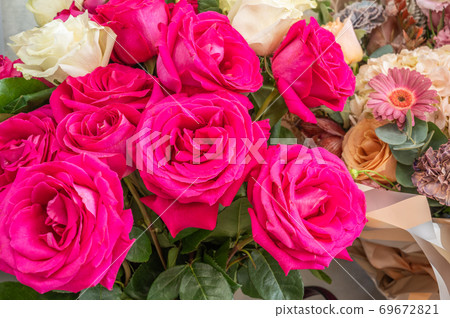 Background from Bouquet of roses and other flowers, close up 69672821