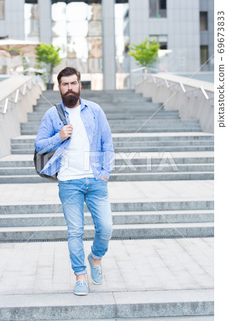 Summer is in. Bearded man go downstairs outdoors.  69673833