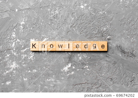Knowledge word written on wood block. Knowledge text on cement table for your desing, concept Knowledge word written on wood block. Knowledge text on cement table for your desing, concept 69674202
