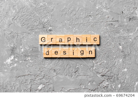 graphic design word written on wood block. graphic design text on cement table for your desing, concept graphic design word written on wood block. graphic design text on cement table for your desing, concept 69674204