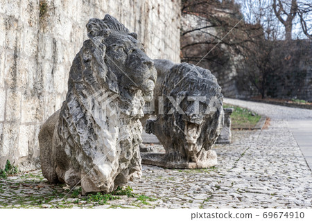 Sculpture of marble lions, a symbol of the city of Brescia, are installed in the park Sculpture of marble lions, a symbol of the city of Brescia, are installed in the park 69674910