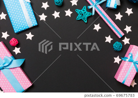 Top view of Christmas decorations on black background. New Year holiday concept with copy space Top view of Christmas decorations on black background. New Year holiday concept with copy space 69675783
