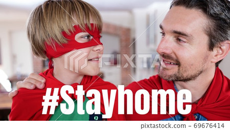 Caucasian boys Wearing capes with words #Stay Home during coronavirus covid19 pandemic Caucasian boys Wearing capes with words #Stay Home during coronavirus covid19 pandemic 69676414
