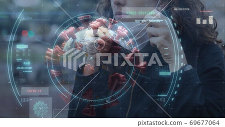 Scope scanning Covid-19 cells against woman wearing face mask 69677064