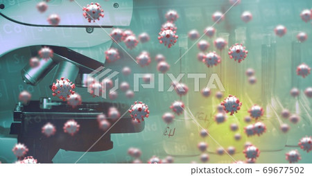 Covid-19 cells against microscope in background Covid-19 cells against microscope in background 69677502