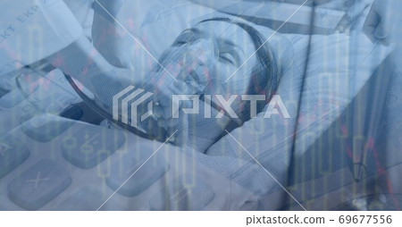 Digital illustration of female patient lying in hospital bed over calculator 69677556