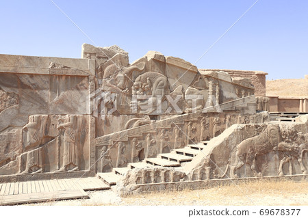 Famous bas-relief on the wall in ancient city Persepolis,  Iran 69678377