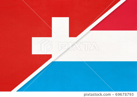 Switzerland and Luxembourg, symbol of national flags from textile. Championship between two countries. 69678793