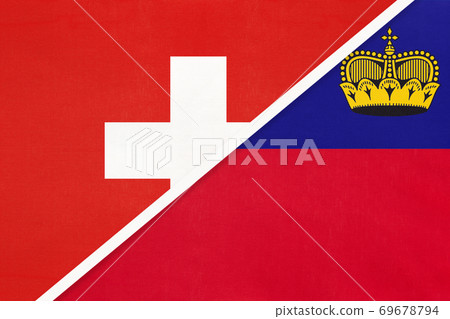 Switzerland and Liechtenstein, symbol of national flags from textile. Championship between two countries. Switzerland and Liechtenstein, symbol of national flags from textile. Championship between two countries. 69678794