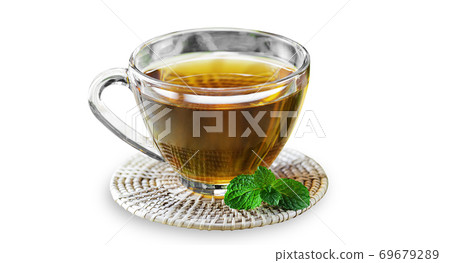 Organic black tea in glass cup on wooden coaster on white isolated background with clipping path. Hot chinese black tea served with mint leaves have good smell. Drinking and beverage concept. 69679289
