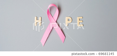 October Breast Cancer Awareness month, Pink Ribbon with HOPE text on grey background for supporting people living and illness. International Women, Mother and World cancer day concept 69681145