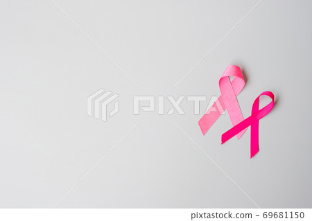 October Breast Cancer Awareness month, Pink Ribbon on grey background for supporting people living and illness. International Women, Mother and World cancer day concept October Breast Cancer Awareness month, Pink Ribbon on grey background for supporting people living and illness. International Women, Mother and World cancer day concept 69681150