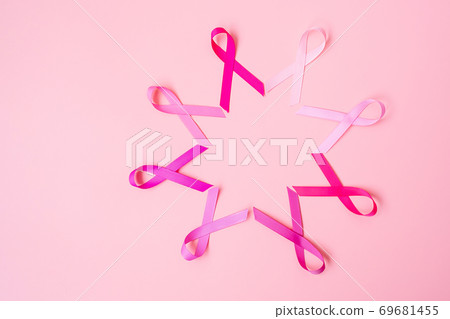 October Breast Cancer Awareness month, Pink Ribbon on pink background for supporting people living and illness. International Women, Mother and World cancer day concept October Breast Cancer Awareness month, Pink Ribbon on pink background for supporting people living and illness. International Women, Mother and World cancer day concept 69681455