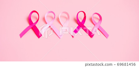 October Breast Cancer Awareness month, Pink Ribbon on pink background for supporting people living and illness. International Women, Mother and World cancer day concept October Breast Cancer Awareness month, Pink Ribbon on pink background for supporting people living and illness. International Women, Mother and World cancer day concept 69681456