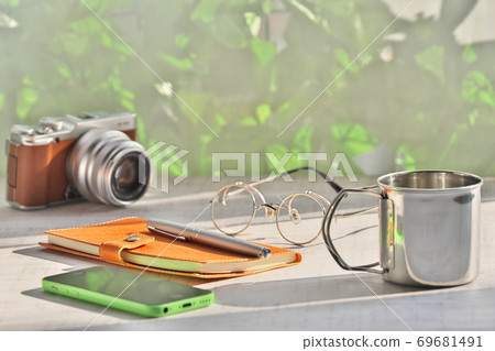 With a smartphone With a smartphone 69681491