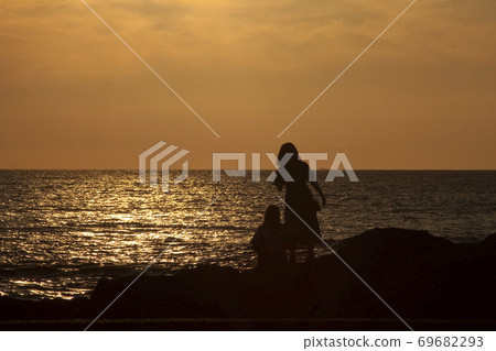 Friends at dusk Friends at dusk 69682293