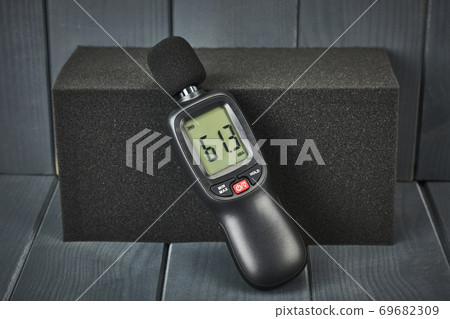 Digital sound level meter with display and control buttons on acoustic foam Digital sound level meter with display and control buttons on acoustic foam 69682309