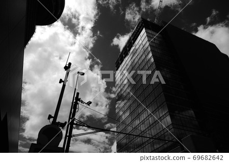 Clouds and landscapes reflected in urban buildings Clouds and landscapes reflected in urban buildings 69682642