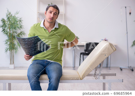 Young man waiting for doctor in the clinic 69685964