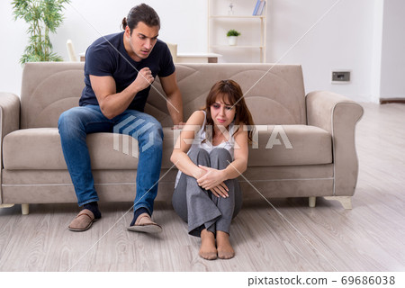 Young couple in domestic violence concept Young couple in domestic violence concept 69686038